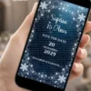 Save the Date Baile de Inverno Digital exibido em celular, com flocos de neve brilhantes, fundo azul elegante e visual inspirado em um baile de inverno encantado.