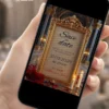 Save the Date Digital A Bela e a Fera exibido em celular, com moldura dourada ornamentada, rosas vermelhas e cenário inspirado em castelo encantado.