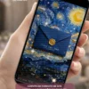 Capa do Convite de 15 Anos Van Gogh Noite Estrelada em formato digital interativo. O design é inspirado na famosa obra "A Noite Estrelada", com céu repleto de estrelas brilhantes, pinceladas artísticas em tons de azul e dourado e um elegante envelope azul selado com lacre dourado de 15 anos. A composição transmite sofisticação, criatividade e um toque artístico, criando uma experiência visual única para os convidados.