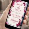Save the Date para 15 Anos Mamma Mia com flores pink, moldura azul e branca, detalhes florais e estilo inspirado na Grécia.